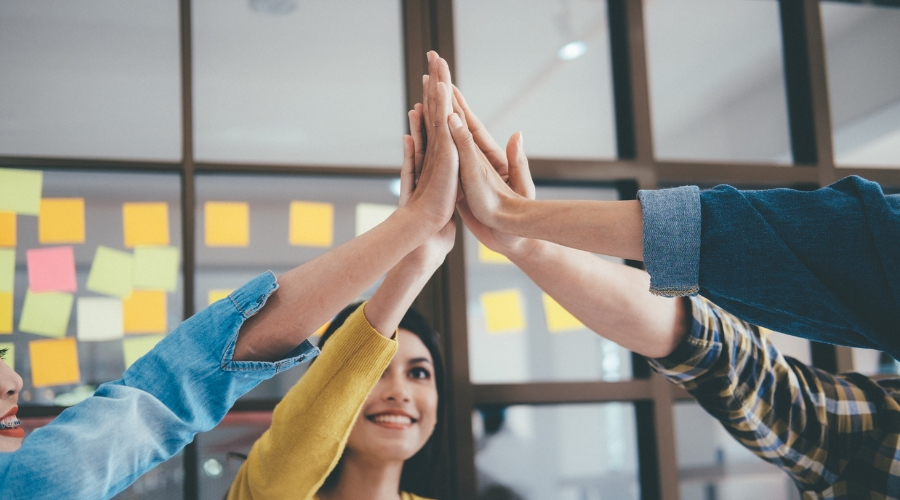 Photo of people high fiving